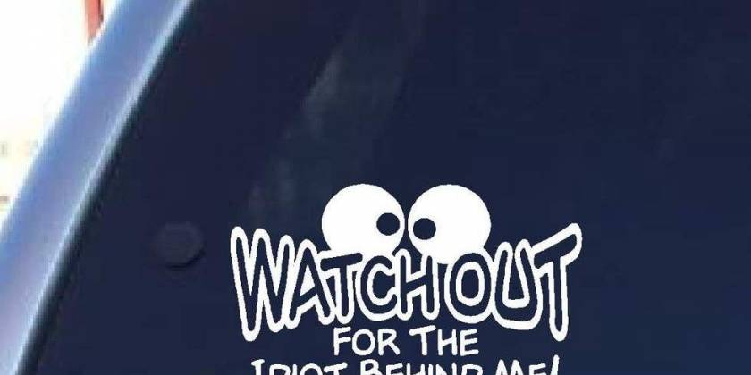 Наклейка посмотри на того кто сзади на стекле авто