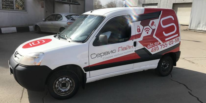 Брендированный Peugeot Partner компании Сервис Лайн